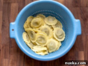 Drained mushroom ravioli tossed in oil to prevent sticking.