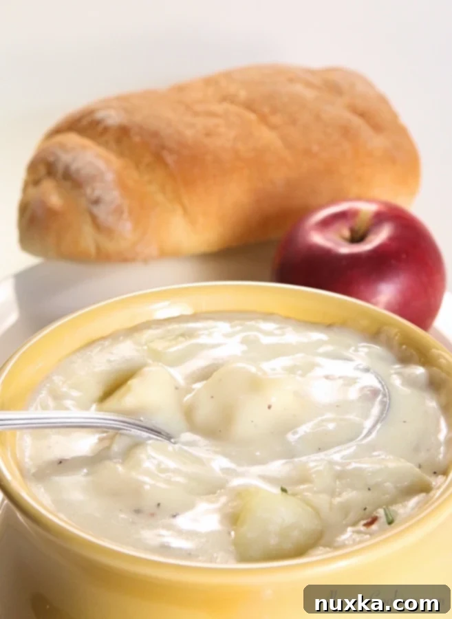 Bowl of rich and creamy baked potato soup ready to serve