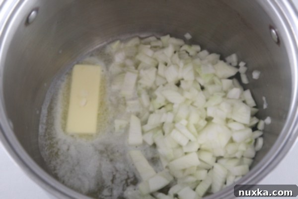 Sautéing onions in butter for baked potato soup base