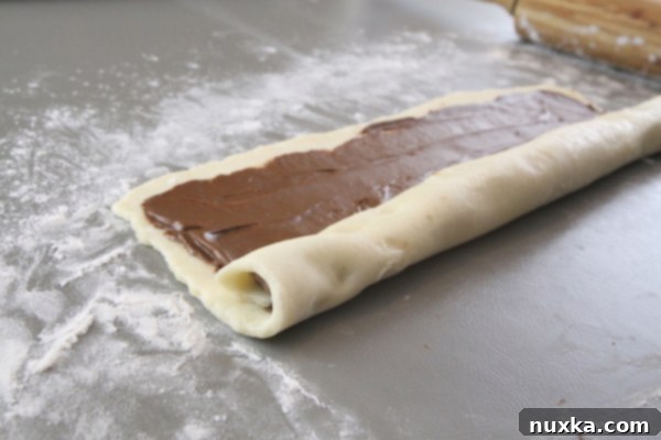 Chocolate-filled Rugelach dough rolled into a log, sealed at the ends.