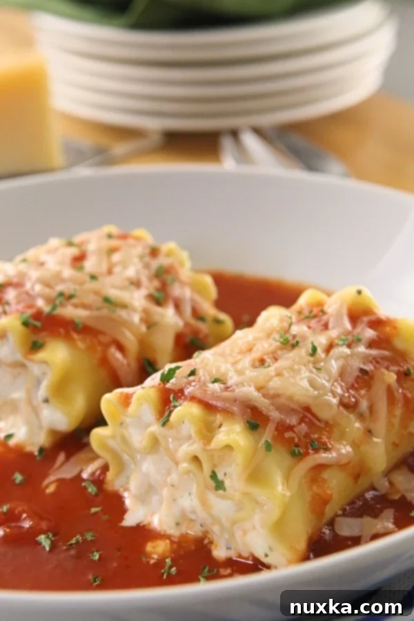 Close-up of golden-brown Lasagna Roll-Ups in a baking dish