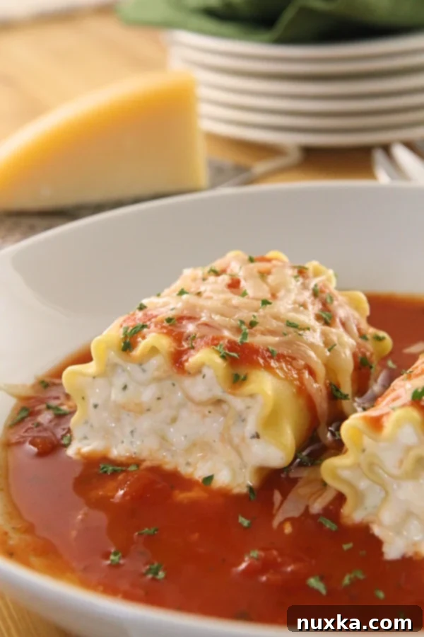 A tray of uncooked Lasagna Roll-Ups, ready for baking