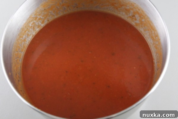 Preparing the spaghetti sauce mixture with water
