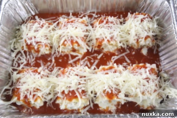Assembled Lasagna Roll-Ups in a foil pan, ready for oven or freezer