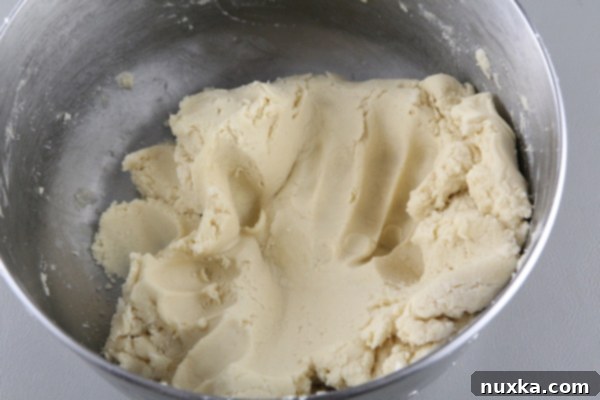 Mixing flour into the cookie dough