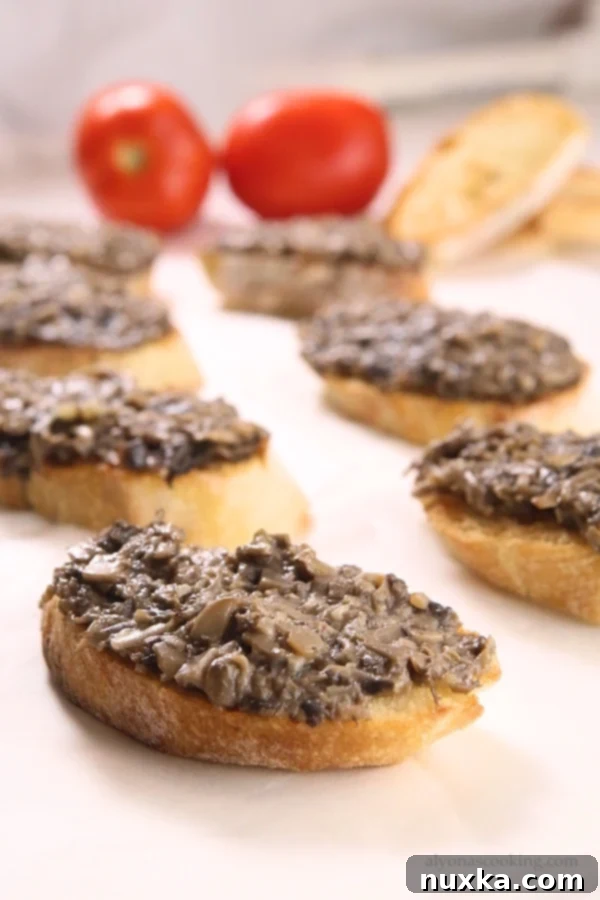 Ukrainian appetizer (Hrinky) or in Russian Grenki. It's finely chopped mushrooms mixed with mayonnaise and garlic then spread over bread. 