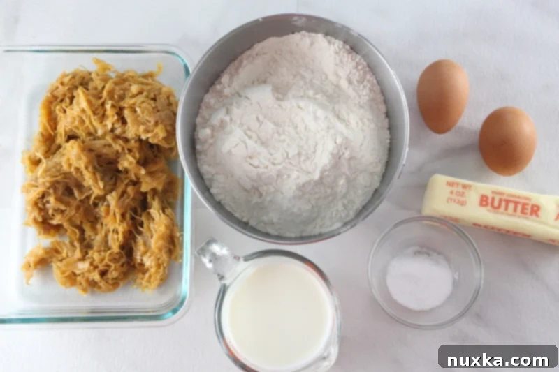 Mixing pierogi dough ingredients in a large bowl.