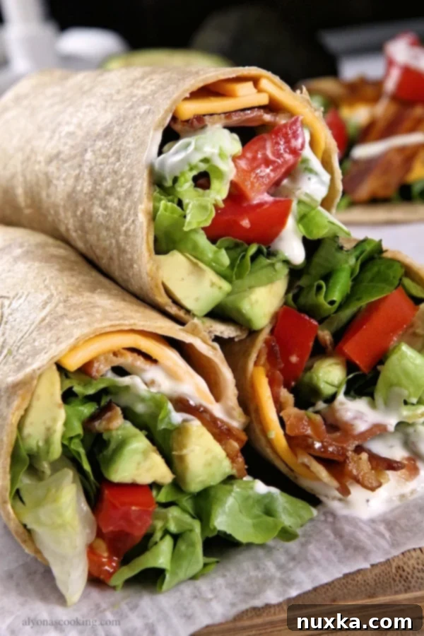 Freshly rolled Avocado Bacon Ranch Wrap, cut in half