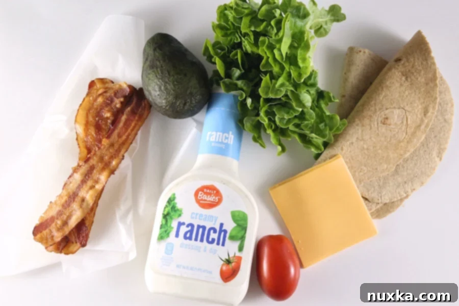 All fresh ingredients laid out for preparing Avocado Bacon Ranch Wraps