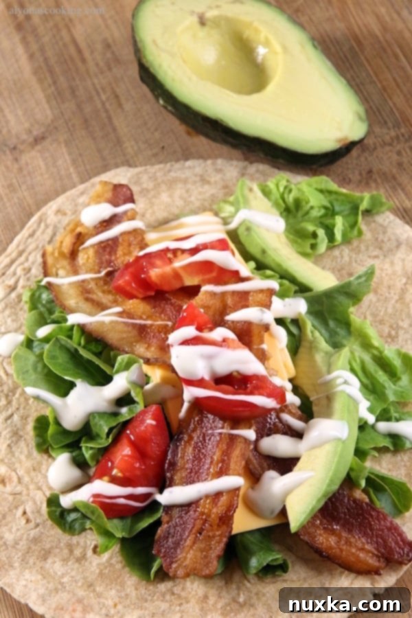 Starting to roll the Avocado Bacon Ranch Wrap