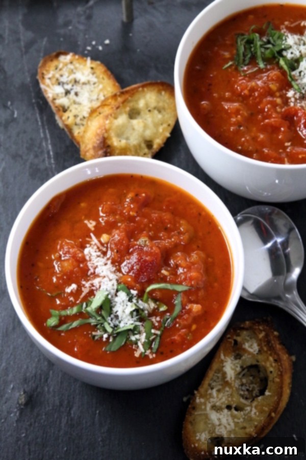 Fresh basil and ripe tomatoes, key ingredients for homemade tomato soup