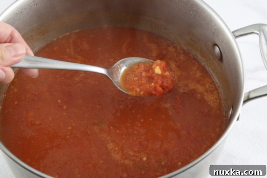 Adding heavy cream and fresh basil to the blended tomato soup