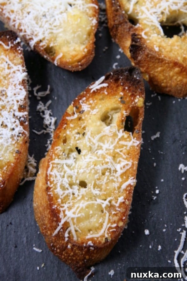 Close-up of Parmesan Garlic Crostini with various toppings, showcasing versatility