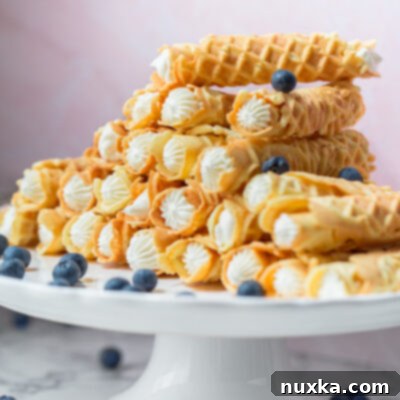 rolled pizzelle with cream that were made with a pizzelle maker called trubochki in Russian
