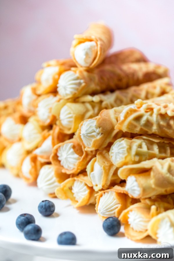 cream filled Pizzelles made from a Pizzelle maker then rolled and filled to trubochki 