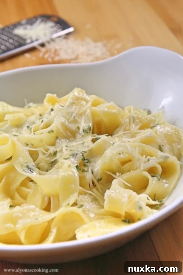 Delicious creamy one-pot alfredo pasta served in a bowl, ready to eat.