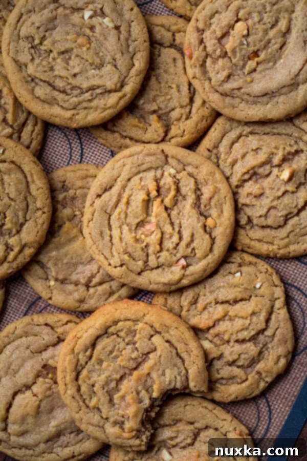 Homemade chewy peanut butter cookies laying flat on top of each other, reminiscent of Subway's style