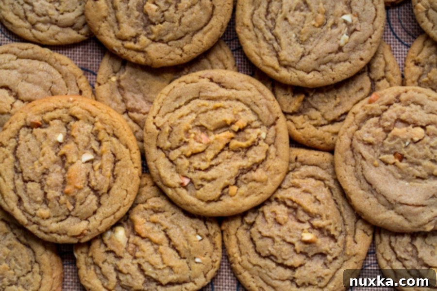 Chewy peanut butter cookies with visible chopped peanuts, ready to enjoy