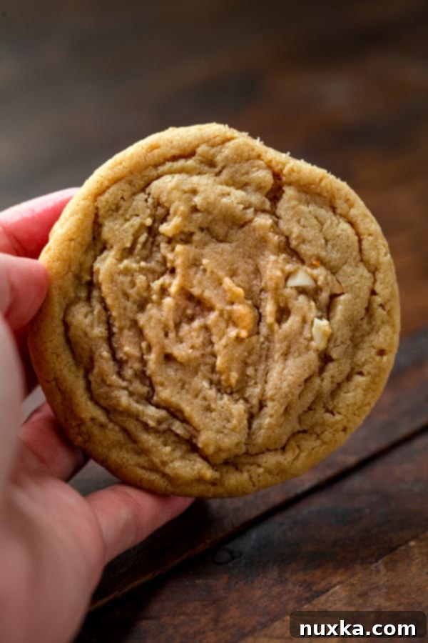 Close-up of freshly baked chewy peanut butter cookies with visible peanuts