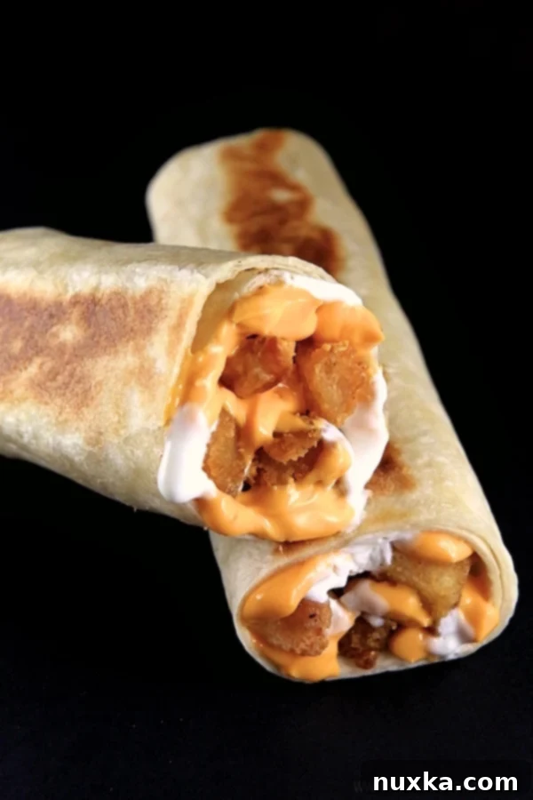 Taco Bell Copycat Cheesy Potato Griller with seasoned potato bites, cheese, and sour cream