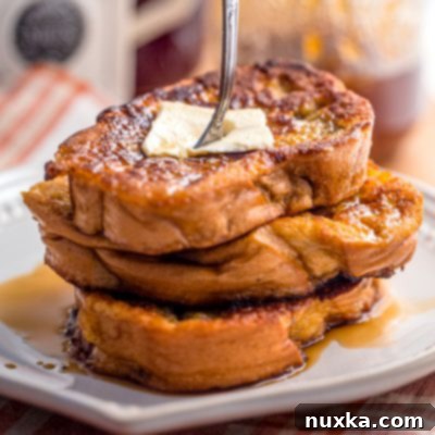 Close-up of golden French toast slices.