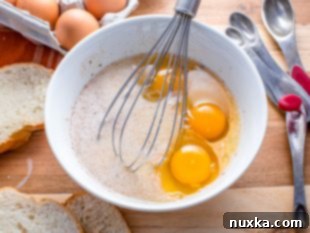Step 2: Adding eggs to the batter.