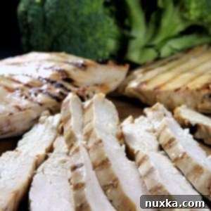 Meal Prep Grilled Chicken Breast 3 Grilled and ready chicken breast strips, fully cooked and portioned for a freezer-friendly meal prep recipe.