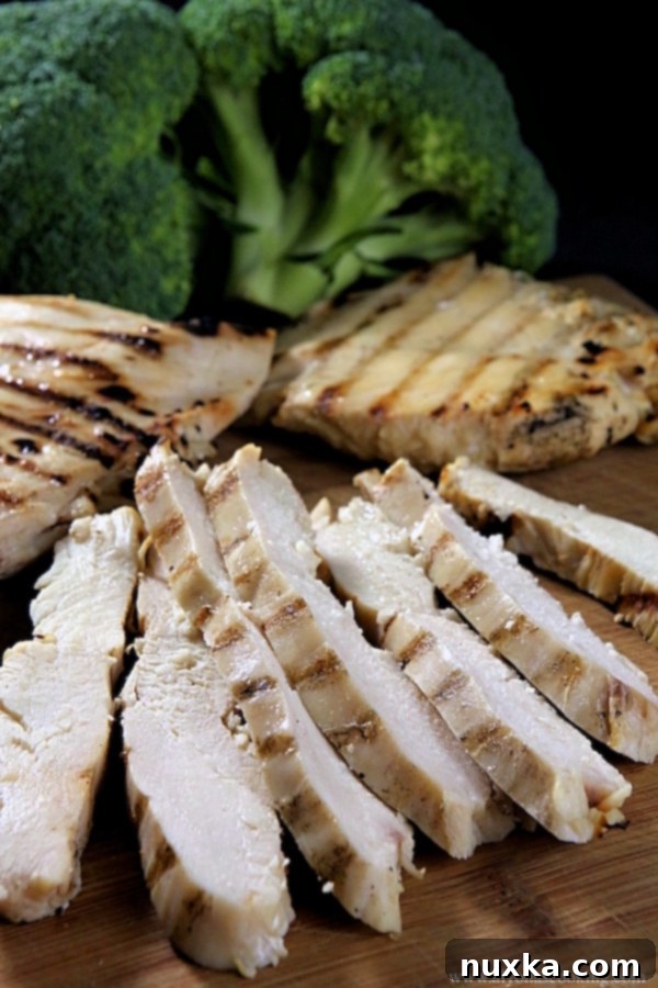 Ready-to-use grilled chicken breast strips, a perfect component for quick and healthy freezer meals.