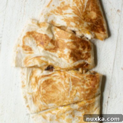Image of a Copycat Taco Bell chicken quesadilla cut into wedges