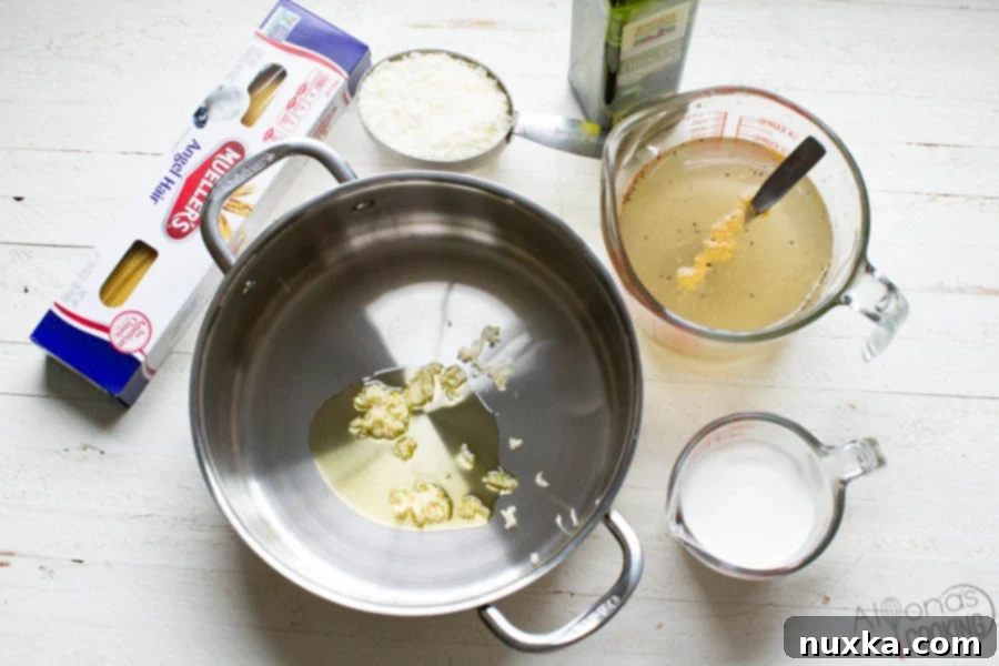 ingredients for angel hair pasta: thin pasta, heavy cream, garlic, parmesan cheese, olive oil, chicken broth, salt, and pepper.