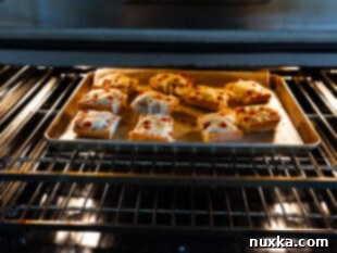 Golden and bubbly French bread pizzas fresh out of the oven, perfectly baked