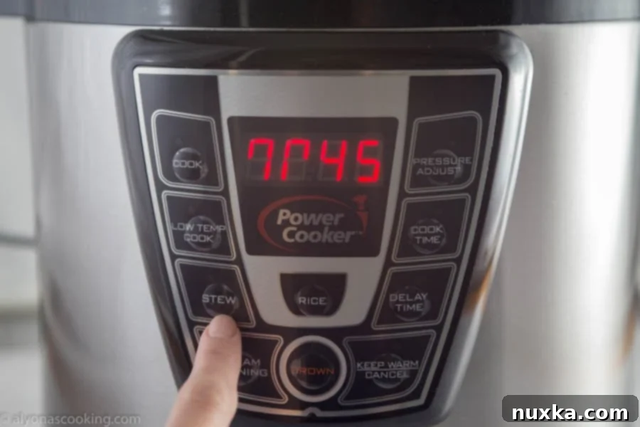 A pressure cooker displaying the cooking time countdown for a 6-quart recipe