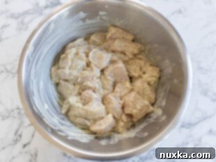 marinating chicken in a creamy mixture