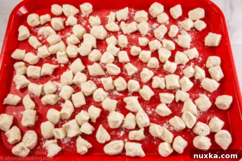 Freshly cut homemade dumplings ready for cooking