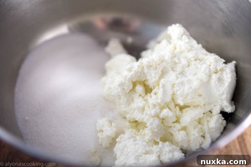 Farmer's cheese donut holes (Ponchiki) dough in a bowl