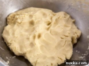 Mixing butter, sugar, and other wet ingredients for the shortbread tart dough.