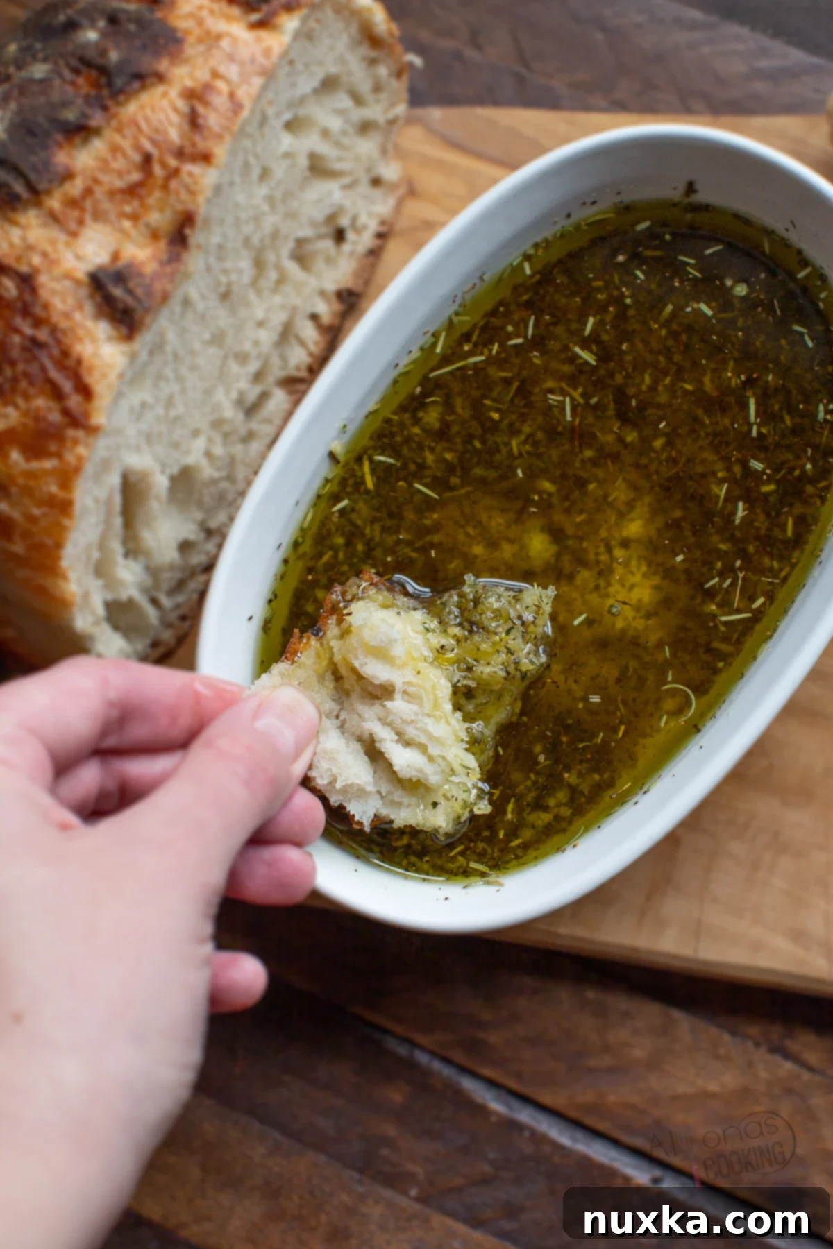 Homemade Bread Dipping Oil made with olive oil, Italian seasoning, fresh garlic, and salt