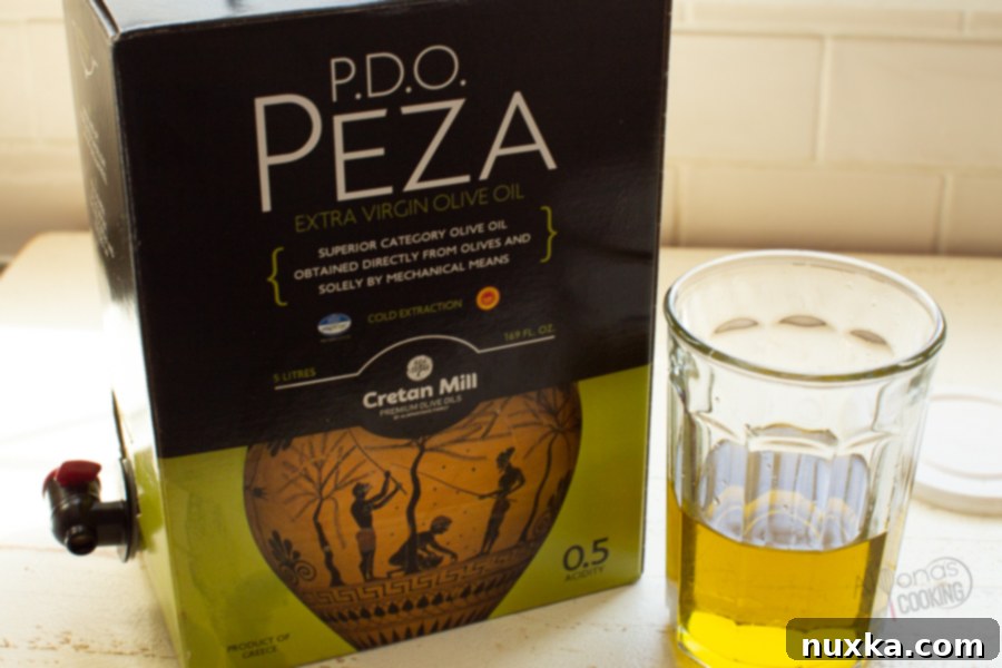 Premium extra virgin olive oil, vibrant green in a bowl, best for bread dipping