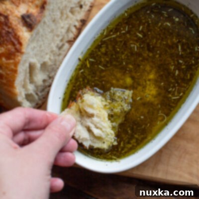 Homemade Bread Dipping Oil in a bowl with fresh bread