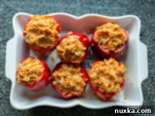 stuffing bell peppers with meat and rice mixture
