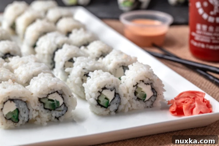 Freshly cut Philadelphia rolls with smoked salmon and avocado