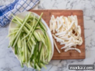 Sliced cucumbers and cream cheese strips for Philadelphia roll