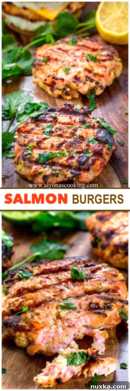 A perfectly assembled salmon burger with melted American cheese, fresh lettuce, and zesty tartar sauce, ready to be enjoyed.