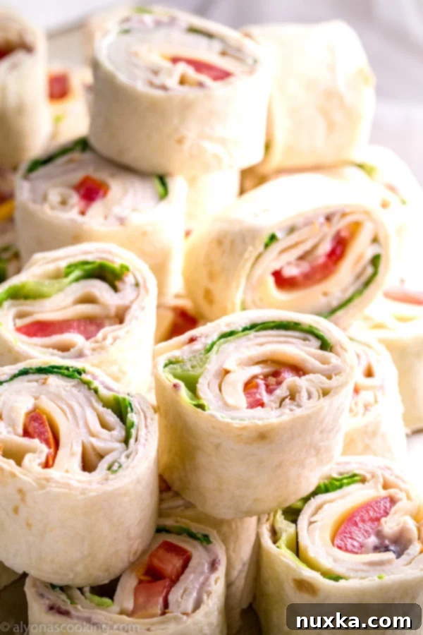 Delicious Costco Copycat Chicken and Swiss Roll-Ups with Cranberry Cream Cheese Spread