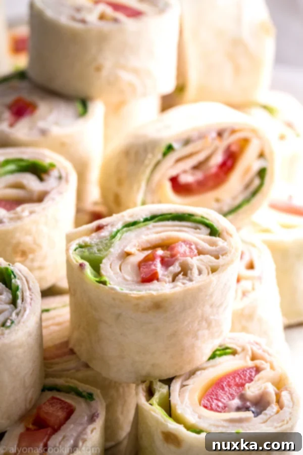 A platter of beautifully sliced Costco Copycat Roll-Ups, ready to be served
