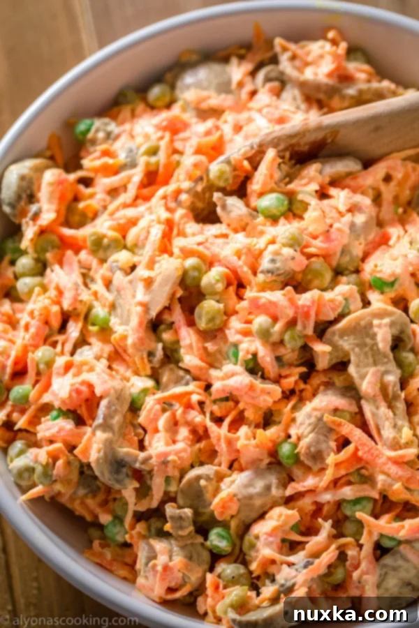 creamy carrot salad with garlic, peas, and mushrooms