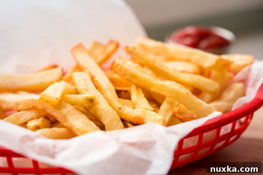 crispy golden french fries piled high