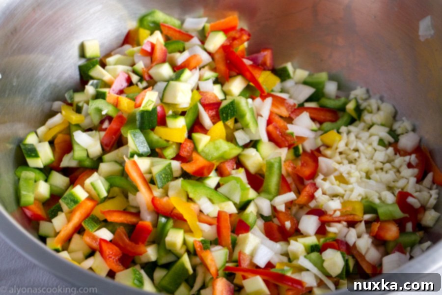 A large tray filled with a fresh batch of roasted vegetables, showcasing their vibrant colors and perfect char