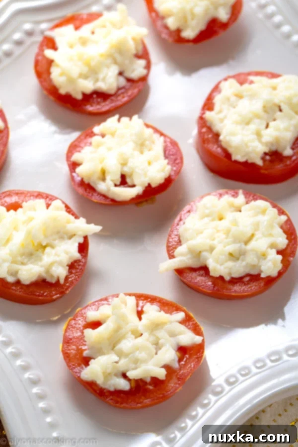 Close-up of a perfectly assembled tomato and cheese appetizer