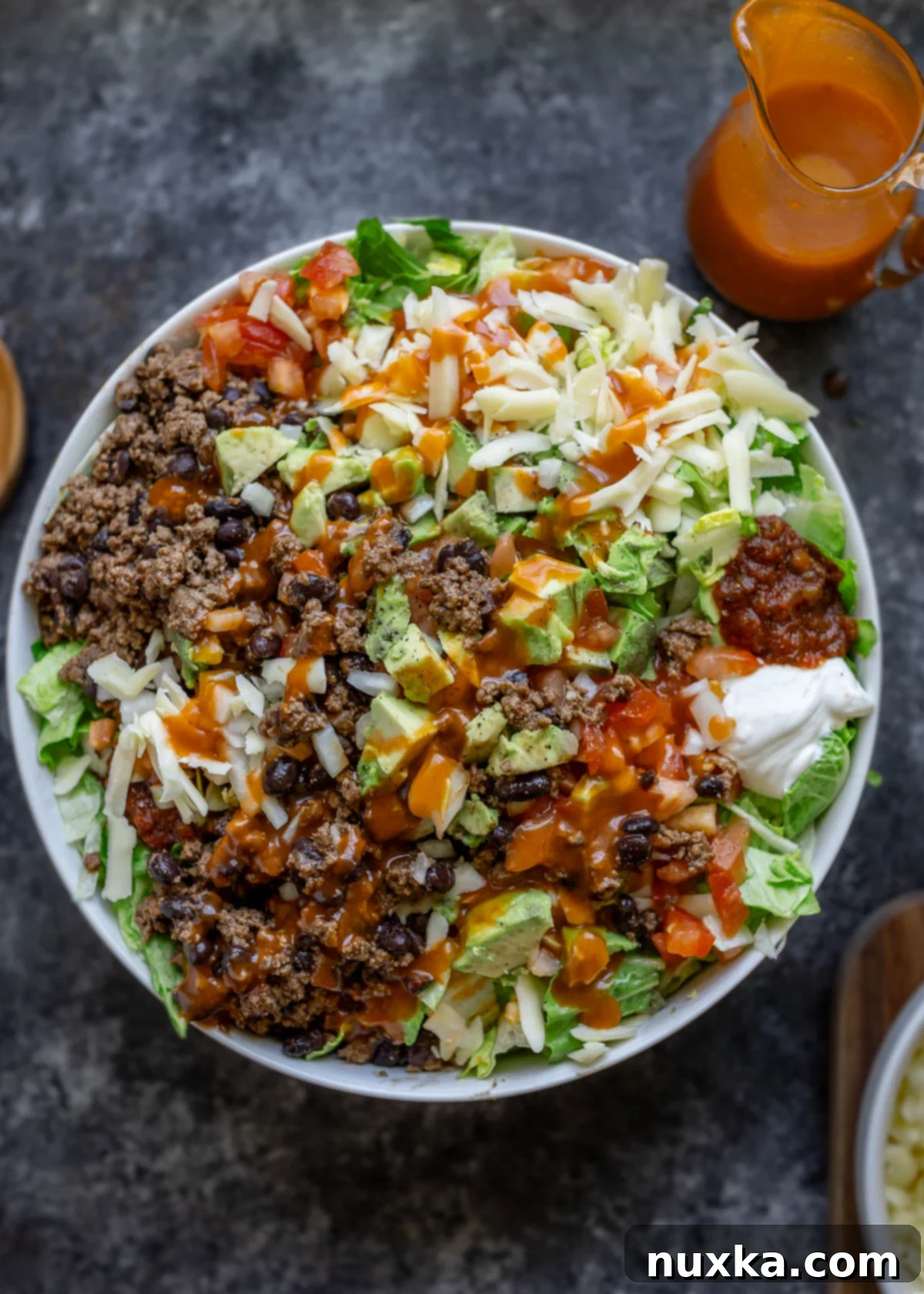 taco salad with homemade Catalina Dressing in a white bowl